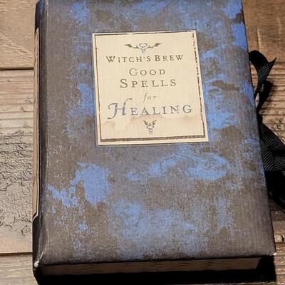 Lot 83: Wheel of the Year Book and Witch's Brew Good Spells Books 