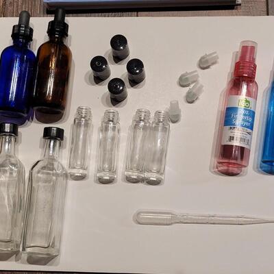 Lot 102: Essential Oil Book and Containers Lot