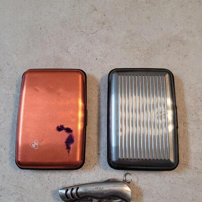 Lot 214: (2) Wallets and Small Pocket knife 