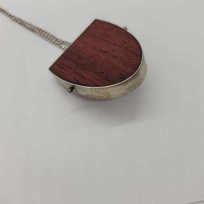 Lot J32: Scarab pendant mounted on wood and silver base