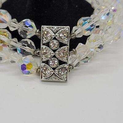 Lot J34: Aurora Borealis Austrian crystal, single strand necklace and triple strand bracelet.