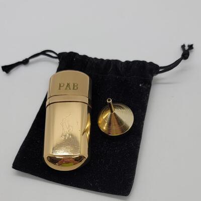 Lot J43 - Ralph Lauren, Goldtone, engraved, purse size, refillable perfume bottle.