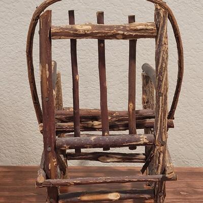 Lot 273: Cornelloki Dolls and Wood Chair