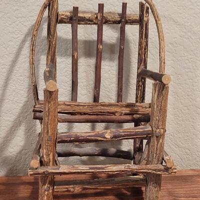 Lot 273: Cornelloki Dolls and Wood Chair