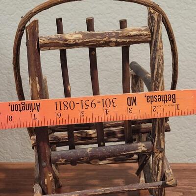 Lot 273: Cornelloki Dolls and Wood Chair