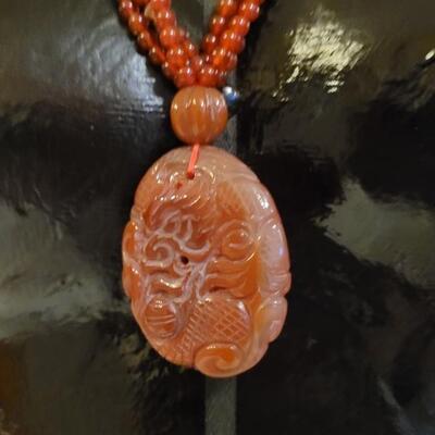 Lot 323: Vintage Asian CORNELIAN Bead Necklace with Matching Carved Dragon Pendant 