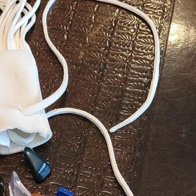 Lot 378: Leather Fringe Pouch Necklace with Gemstones and Green Glass Triangle 