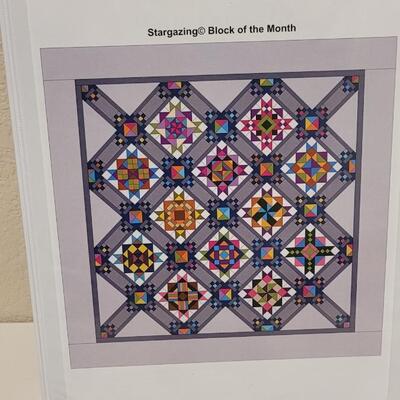 Lot 444: Stargazing Block of the Month Patterns in Binder and Stars of a New Day Block of the Month Club Patterns in Binder