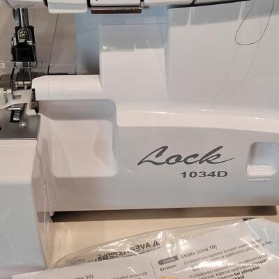 Lot 481: Brother Lock 1034D Overlock/Serger Machine with Box and Manual 
