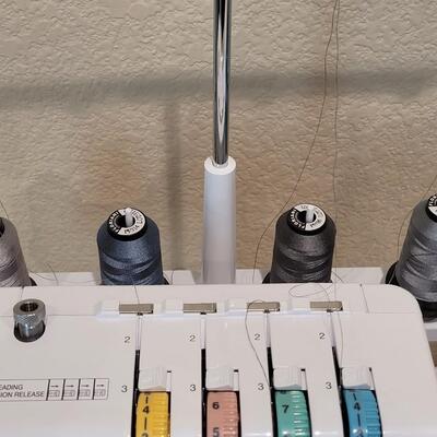 Lot 481: Brother Lock 1034D Overlock/Serger Machine with Box and Manual 