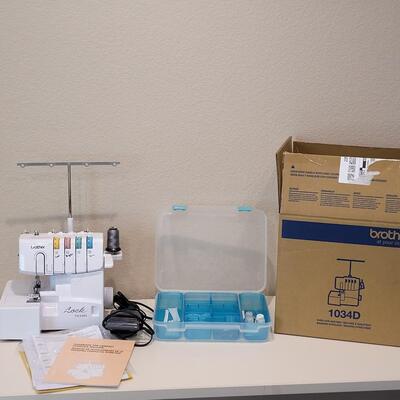 Lot 481: Brother Lock 1034D Overlock/Serger Machine with Box and Manual 
