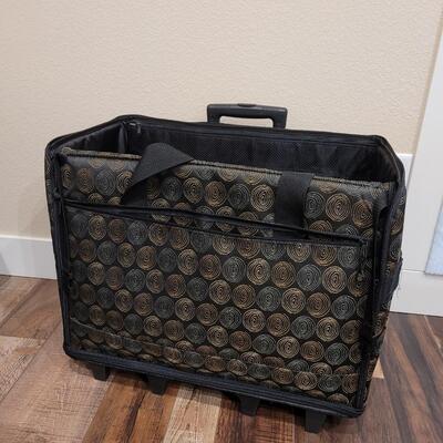 Lot 504: Sewing Machine Travel Case with Wheels and Telescope Handle