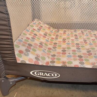 Graco Pack & Play. Tan & Brown with Wild Animals Circles Print