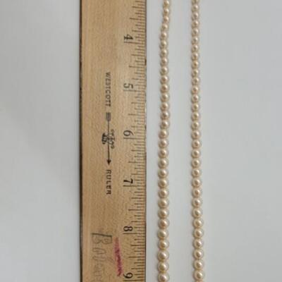 J56 - Two Pearl Necklaces. One Freshwater Pearls with 14K Clasp and Beads. One in Costume Pearls.