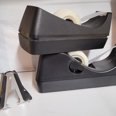 Lot 553: Office / School Supplies Bundle - Tape Dispensers, Protectors, Staple Puller and Clipboard