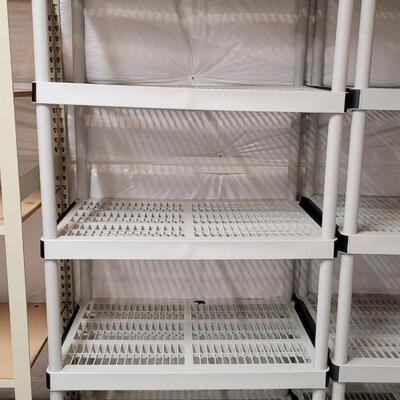 Lot 569: (2) Plastic Shelving Units (both show some dings)