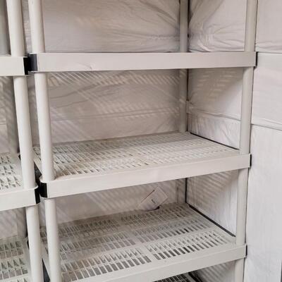 Lot 569: (2) Plastic Shelving Units (both show some dings)