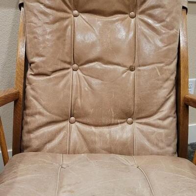 Lot 589: Leather Glider (missing button but we have it so it can be repaired)