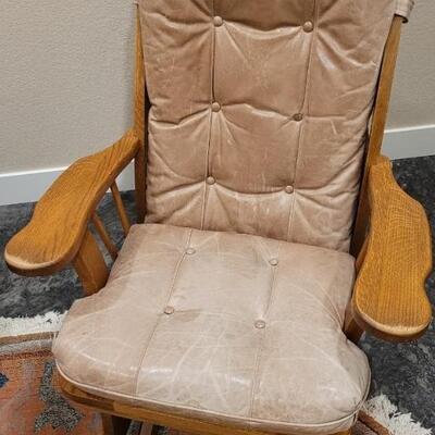Lot 589: Leather Glider (missing button but we have it so it can be repaired)