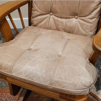 Lot 589: Leather Glider (missing button but we have it so it can be repaired)