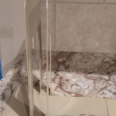 Lot 591: Metal Bookends and HP 10b (doesn't turn on)