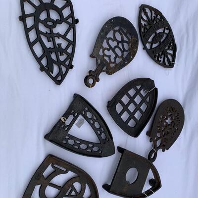 Lot of 7 antique cast iron trivets