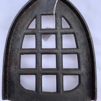 Lot of 7 antique cast iron trivets