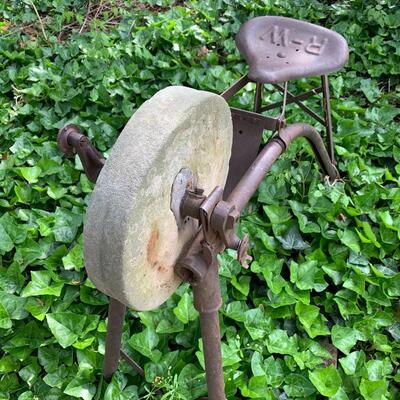 Primitive antique grinding wheel