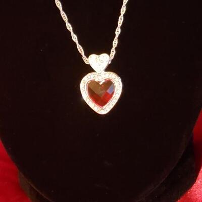 Sterling silver heart  garnet and diamond pendant and 20 in sterling chain 14.2 g