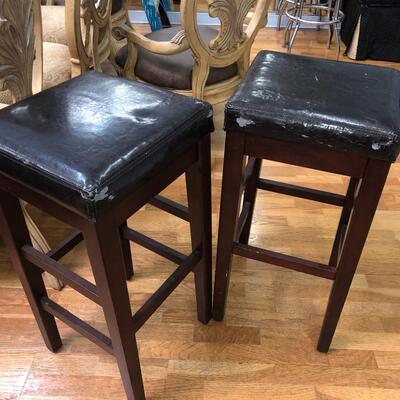 Two faux leather and wood  barstools