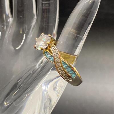 Goldtone Twisted Clear & Blue CZ Ring