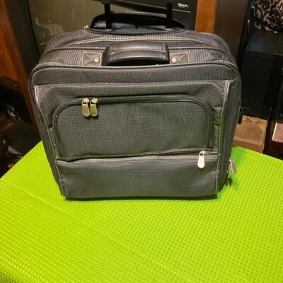 Carry-on travel bag with handles and wheels