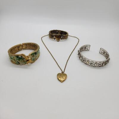 Lot J71: Hinged bangle bracelet with sea glass, rhinestone cuff bracelet, sweetheart stretch bracelet and locket on 16