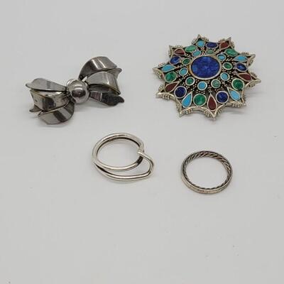 Lot 75: Two Sterling rings, ART brooch and a silvertone bow pin