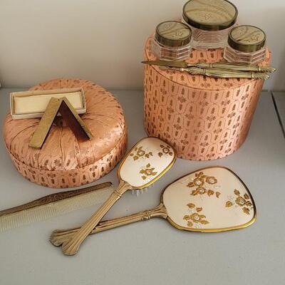 Lot 81: Vintage Vanity set in great condition includes a travel comb by Zell and  and a decorative box