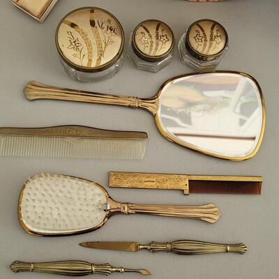 Lot 81: Vintage Vanity set in great condition includes a travel comb by Zell and  and a decorative box