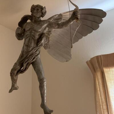 Winged silver man