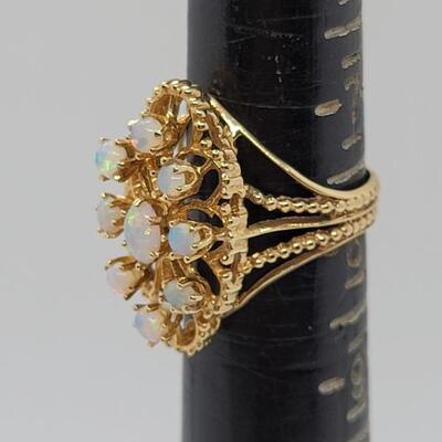 J83: 14k yellow gold Opal cluster ring sz. 8 and a pair of opal earrings 