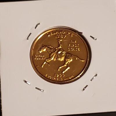 Bu 1999 Gold plated quater 