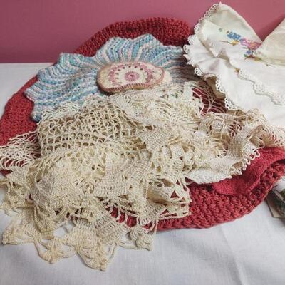 150 - Placemats, Doilies, and Embroidery Work.