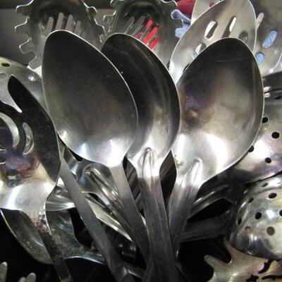 Crock Full of Assorted Spoons:  Slotted, Solid, Pasta Servers
