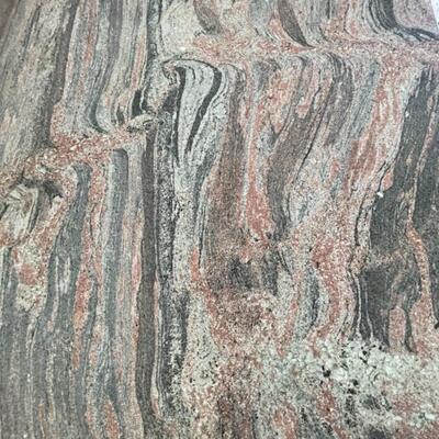  Granite Slab dining table with 6 ;acquired ash chairs upholstered in black and grey stripes.