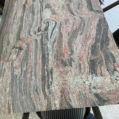  Granite Slab dining table with 6 ;acquired ash chairs upholstered in black and grey stripes.