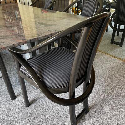  Granite Slab dining table with 6 ;acquired ash chairs upholstered in black and grey stripes.