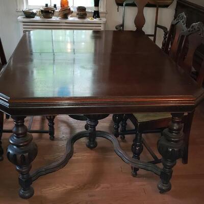 Antique table with five chairs