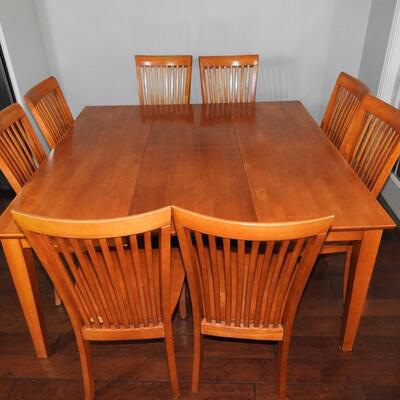 Dining table with tuck away leaf