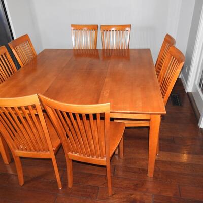 Dining table with tuck away leaf