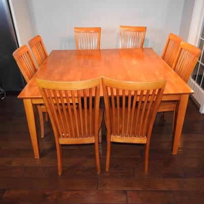 Dining table with tuck away leaf