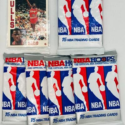 Michael Jordan Basketball Card and 5 Unopened Packs of Basketball Cards