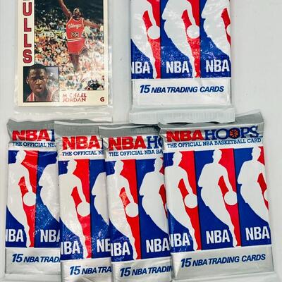 Michael Jordan Basketball Card and 5 Unopened Packs of Basketball Cards